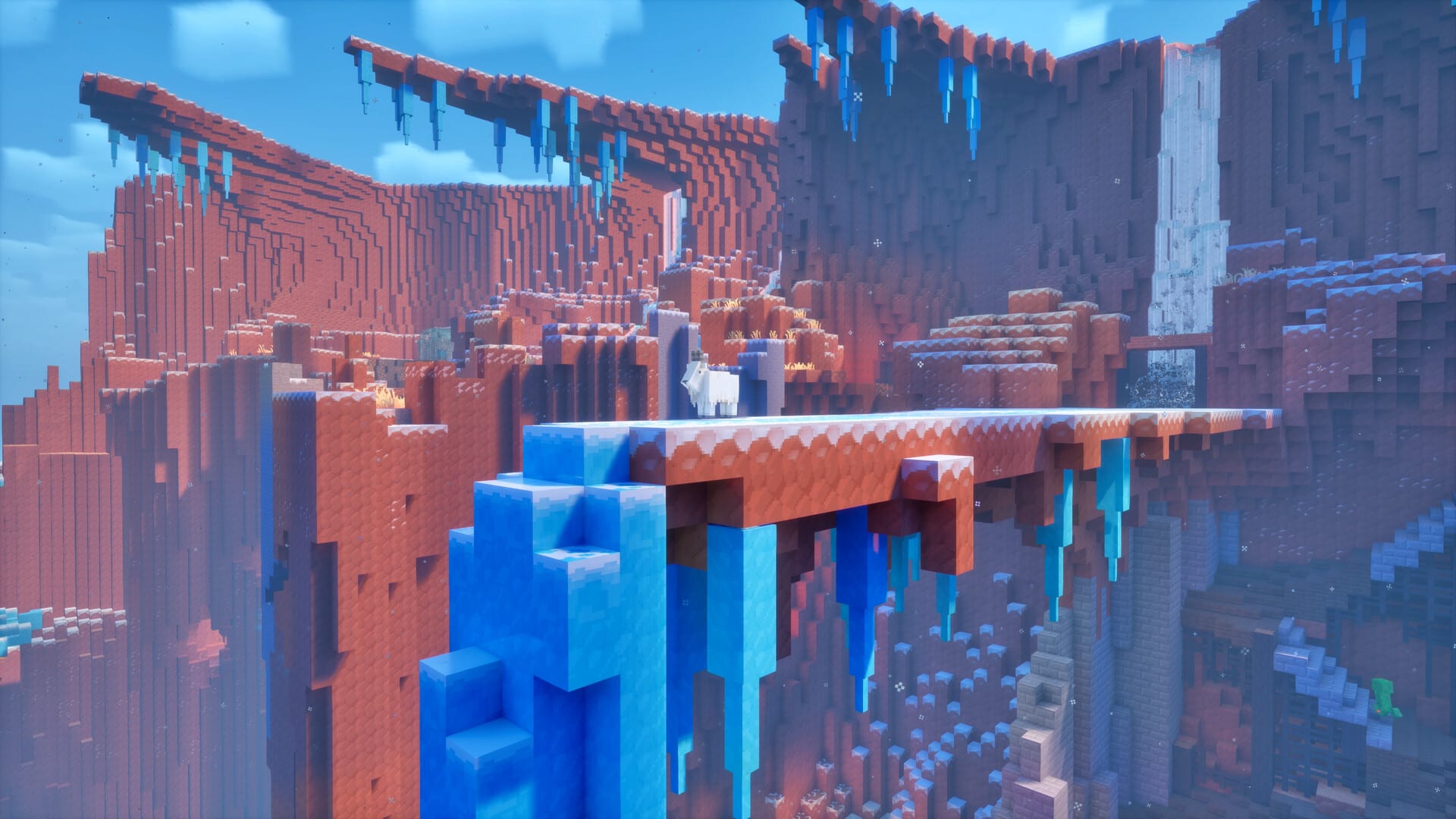 Paisaje de bloques de roca rojiza con carámbanos azules colgando de una cornisa; una cabra blanca camina por un puente helado y una cascada cae al fondo.