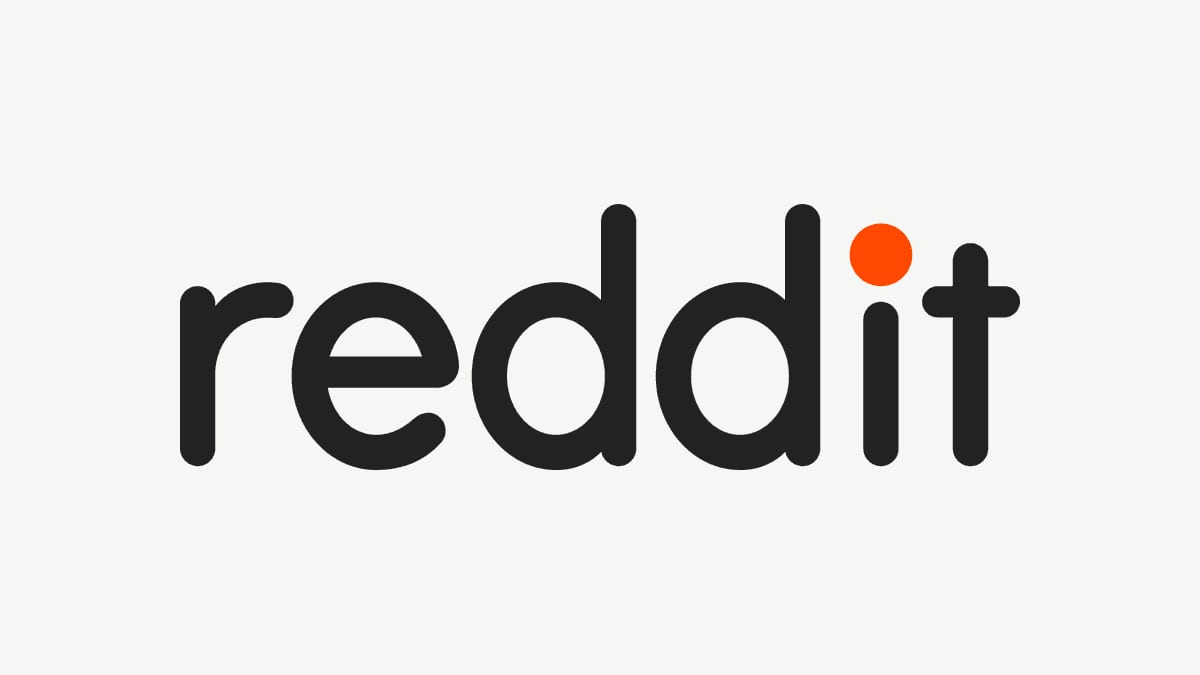 Logotipo de Reddit: la palabra reddit en letras negras minúsculas con el punto de la i en naranja, sobre fondo gris claro.
