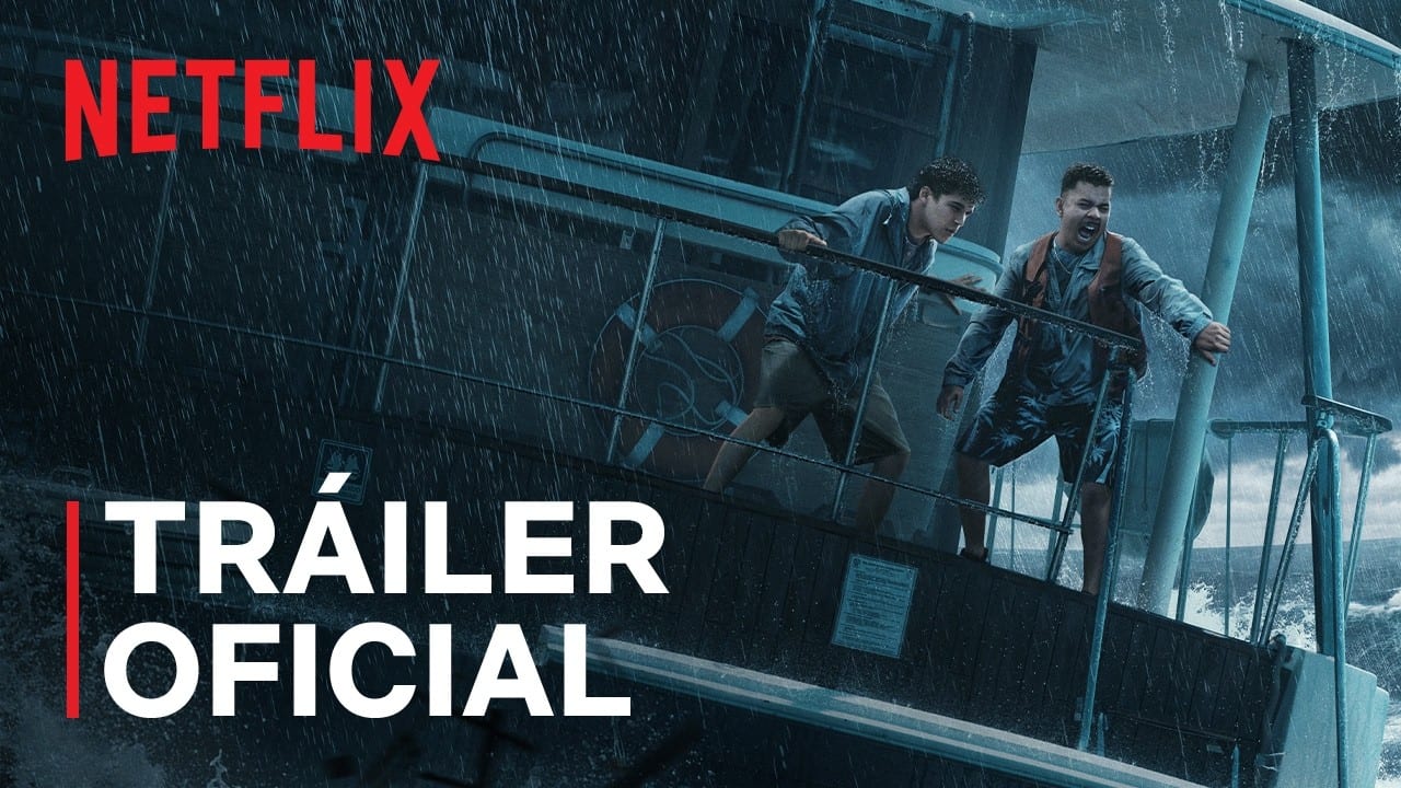 Two young people cling to the railing of a yacht battered by rain and waves, in the trailer poster for Contra el huracán.