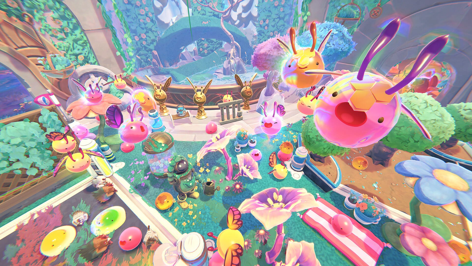 Colorful slimes, some with wings, surround a rancher in a garden full of giant flowers.