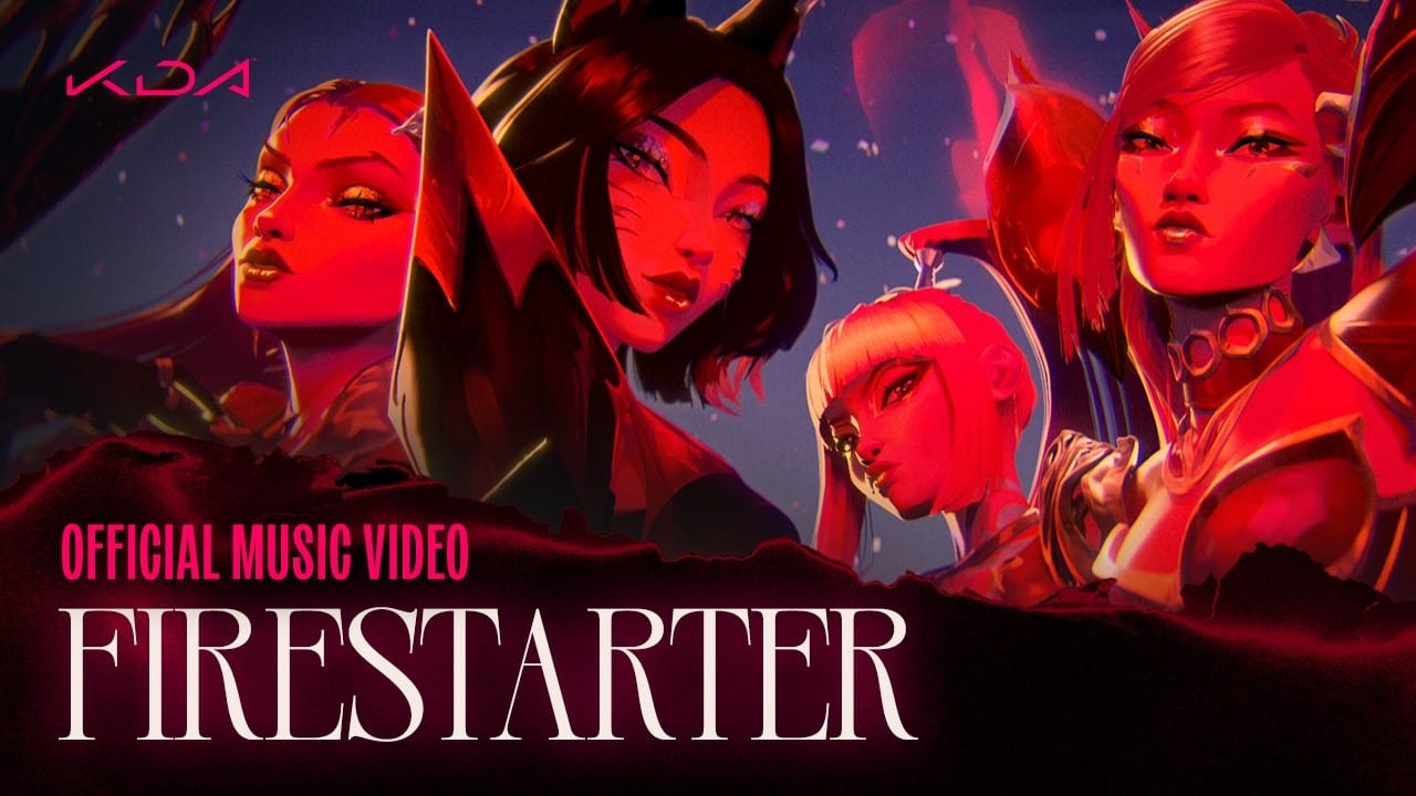 Animated K/DA characters lit in red against a night sky, with the words Official Music Video and the title FIRESTARTER below.