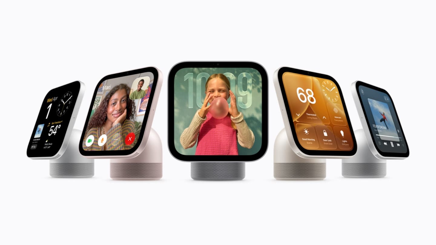 Five tabletop HomeView displays in different colors, showing a video call, a clock, a thermostat and music.