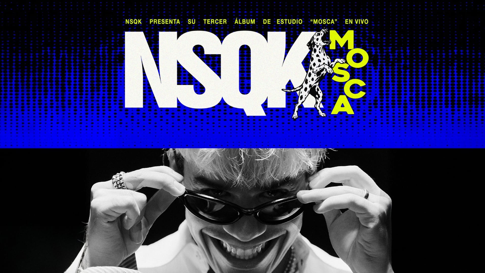 Arte promocional de la gira, con el nombre NSQK en letras blancas sobre fondo azul y, debajo, el rapero sonriendo en blanco y negro mientras se baja unas gafas oscuras.