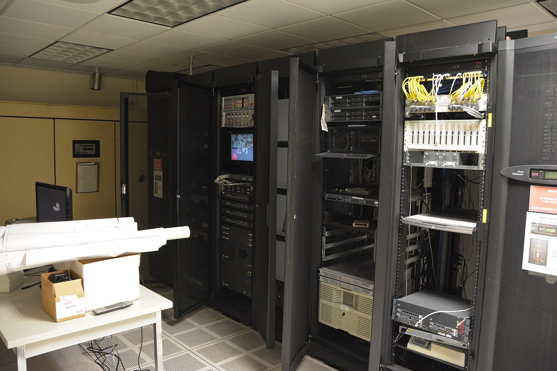 Black cabinets in a server room, with network equipment and yellow cables in view, in a file photo.