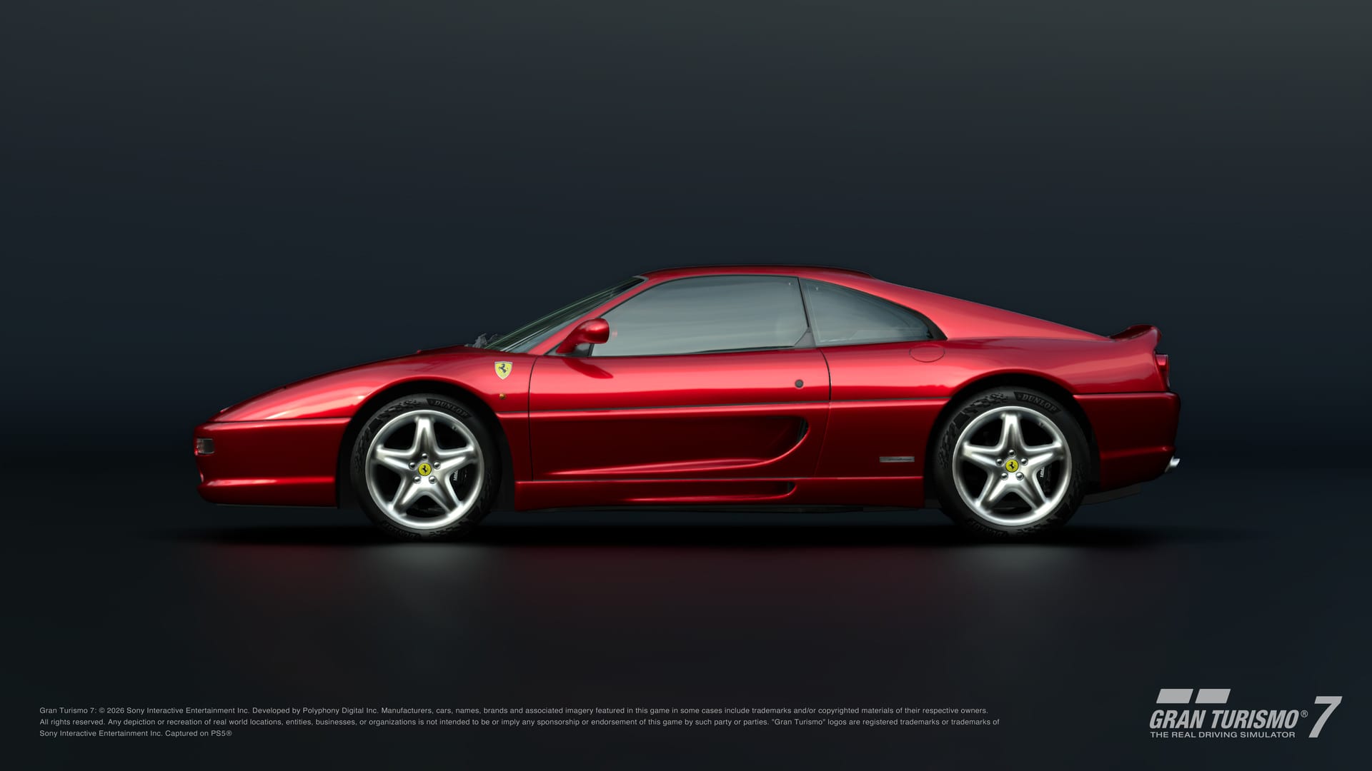 Perfil de un Ferrari F355 rojo con rines plateados sobre un fondo oscuro con reflejo en el piso.