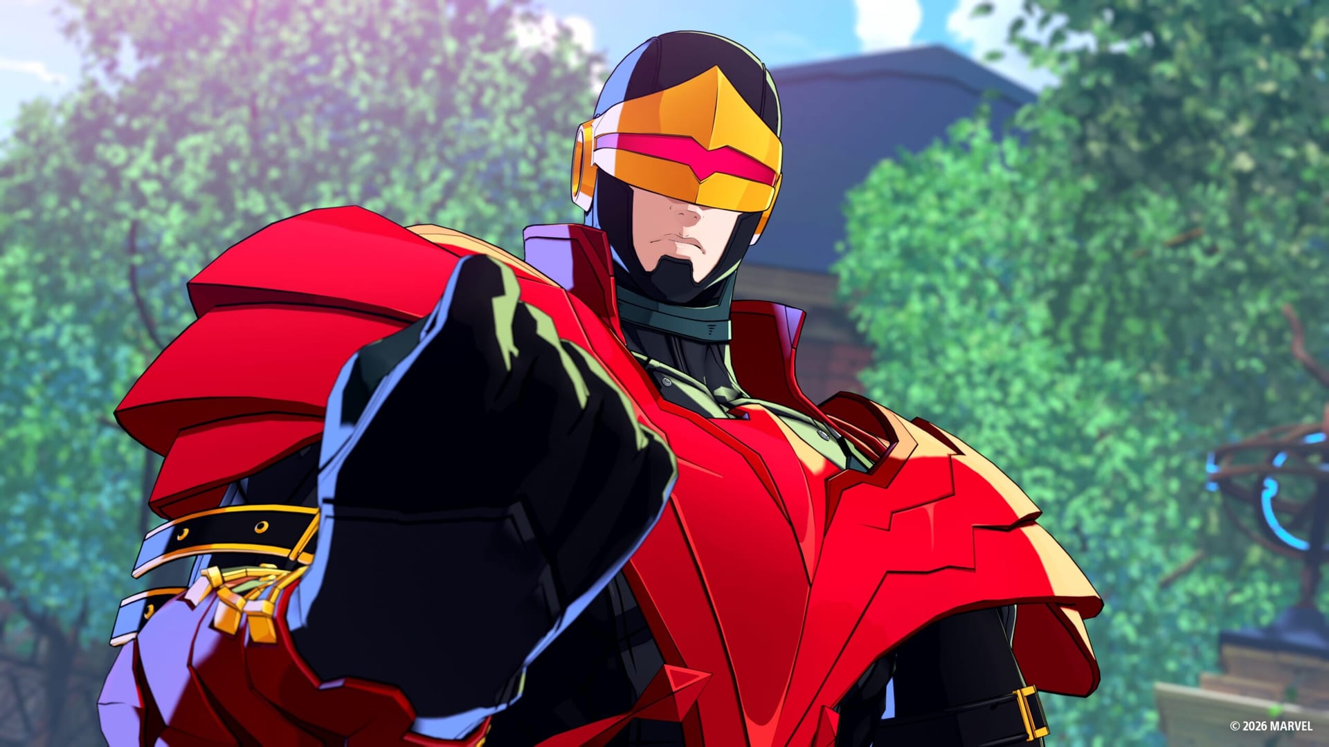 Cyclops in a gold visor and red armor points a fist at the camera in front of trees and a blue-roofed building.