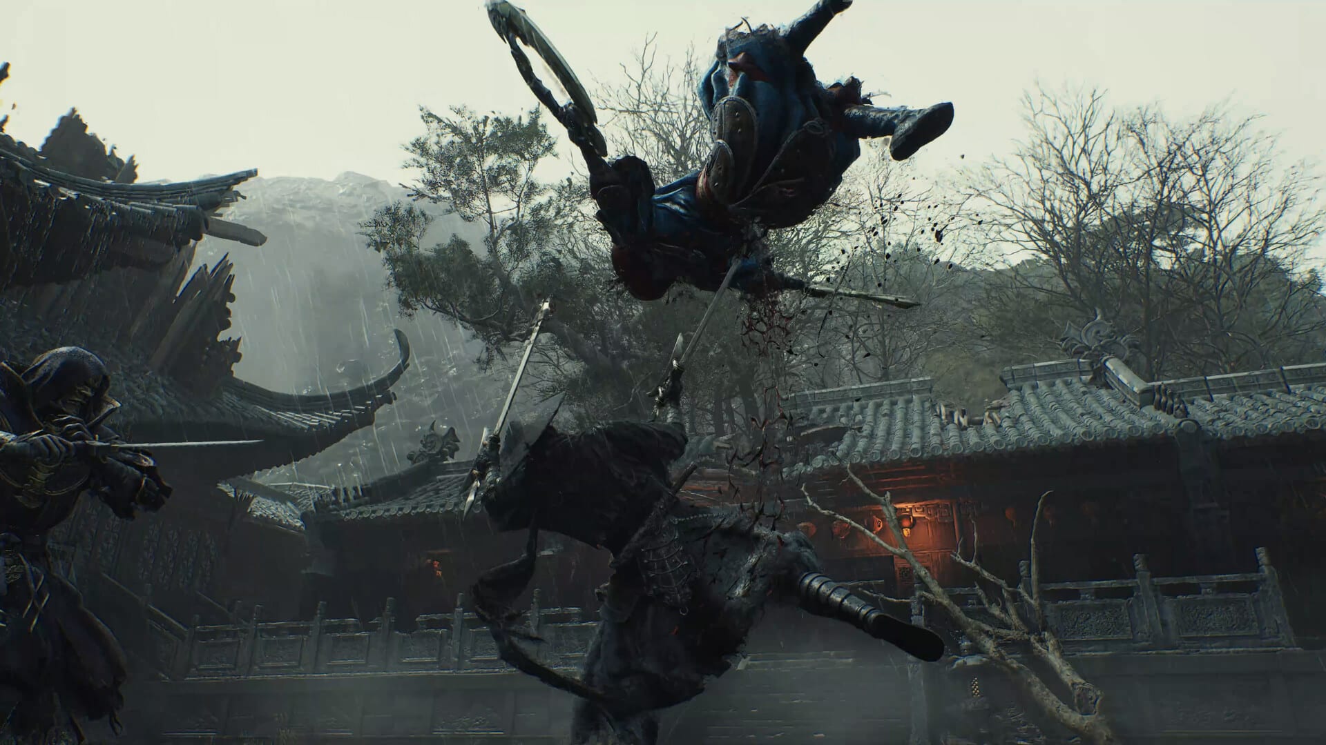 A warrior leaps through the air between two swordsmen in the rain, in front of temple rooftops.